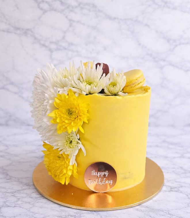 Sunshine yellow buttercream cake with white and yellow chrysanthemums