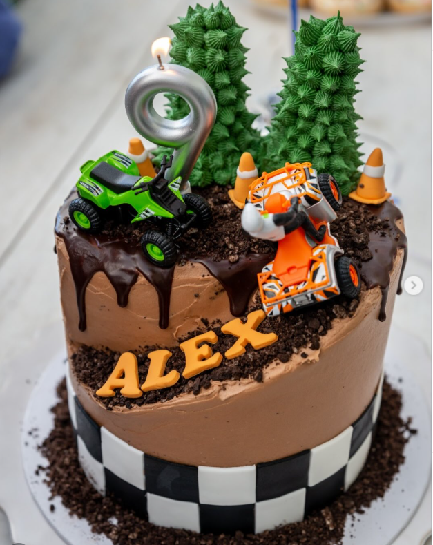 ALEX monster truck chocolate drip cake with toy trucks and trees