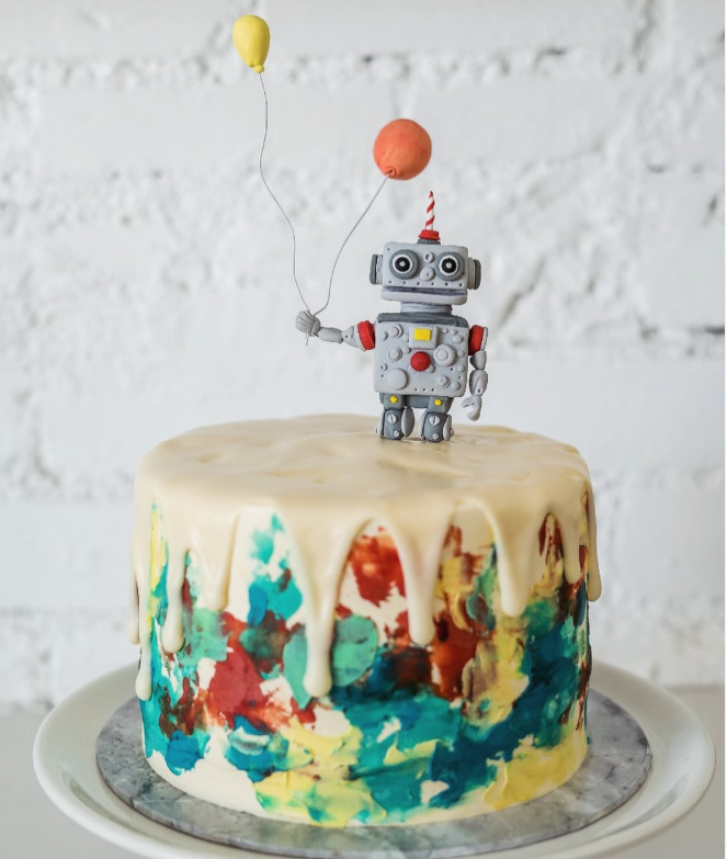Robot drip cake with painted watercolour base and yellow balloons