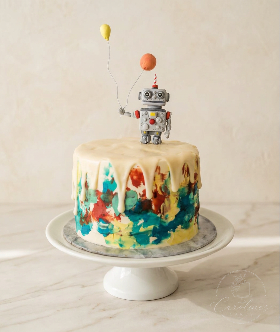 Robot drip cake with painted watercolour base and yellow balloons