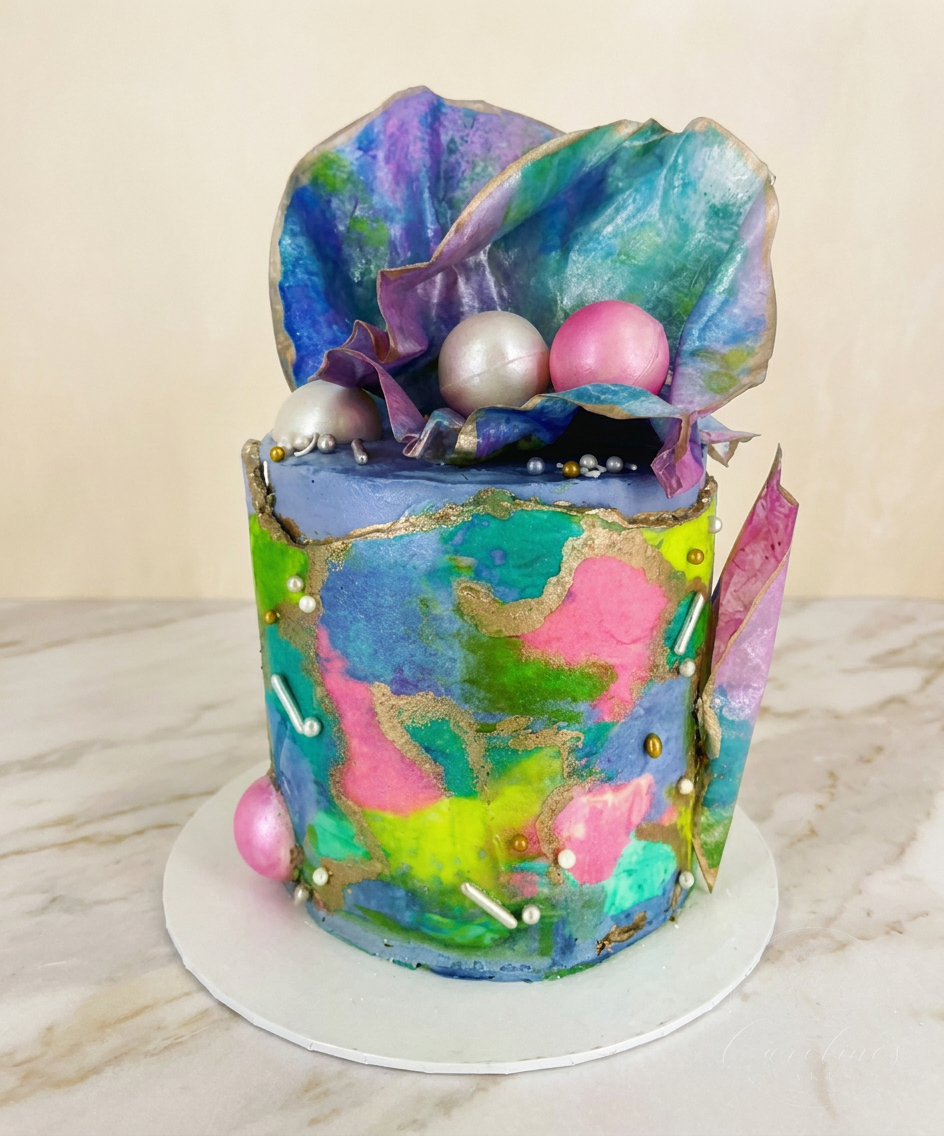 Hand painted watercolour buttercream cake with wafer paper sails and pearls