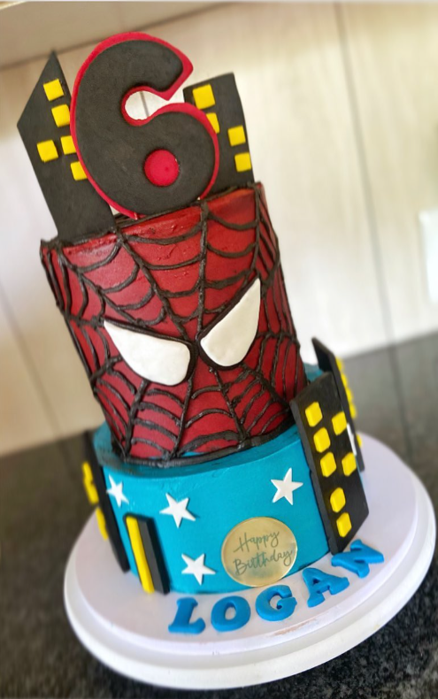 Spider-Man two-tier 6th birthday cake with city skyline